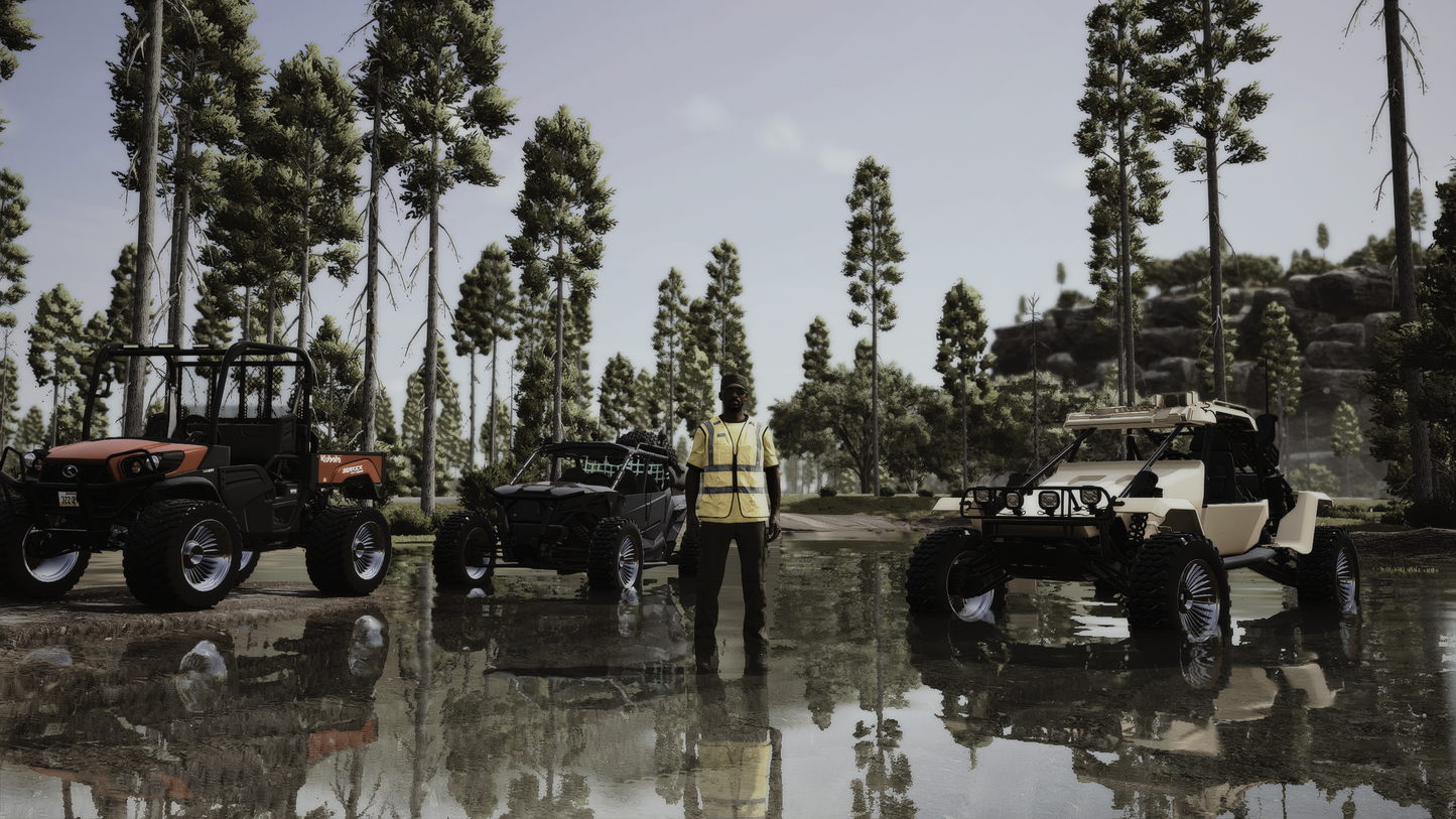 Person standing next to off-road vehicles in a forested area